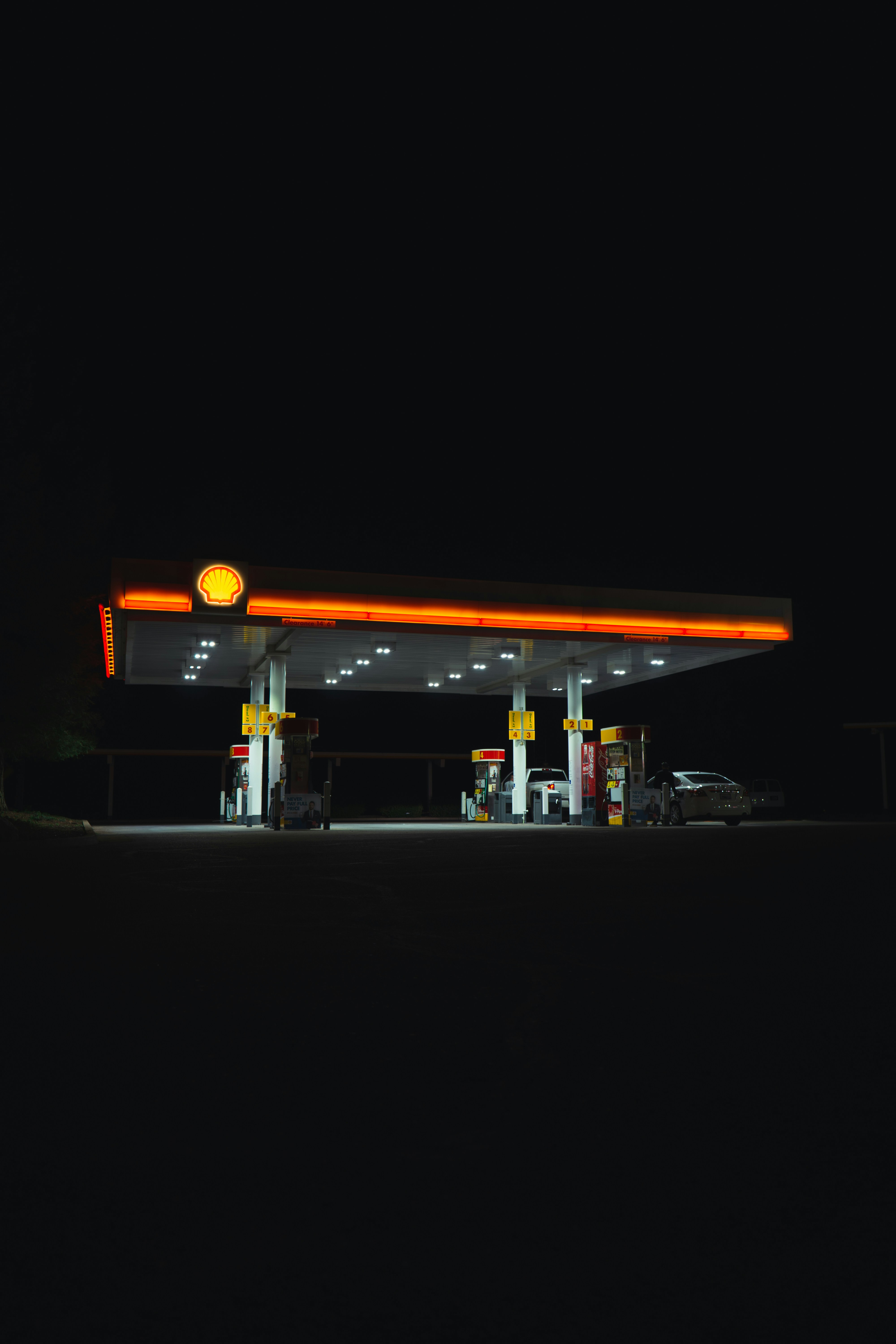 Safety cones and fuel station forecourt at dusk